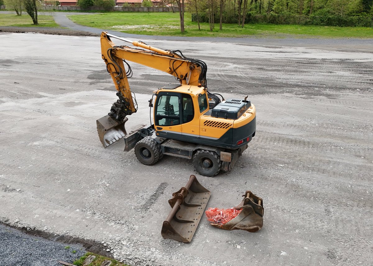 An excavator seen from above on a construction site